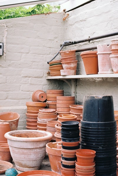 Brown wood brown clay POTS on the shelf
